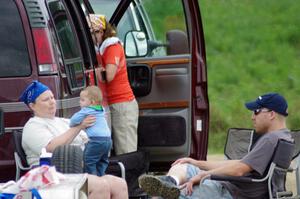 Mary Utecht, Carrie Carlson and Will Cammack watch Carrie's nephew