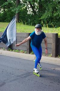 Skater with flag in the parade