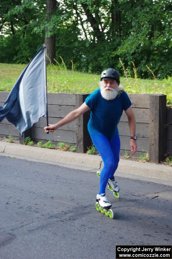 Skater with flag in the parade