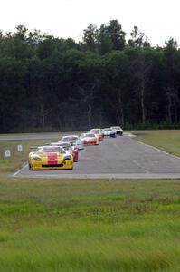 The field streams into corner 4 on the first lap