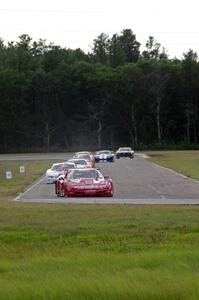 Amy Ruman's Chevy Corvette leads the field on lap two after Tony Ave spun at turn 12