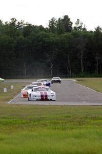 The field streams into corner 4 on the second lap