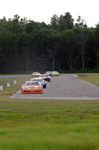 The field streams into corner 4 on the second lap