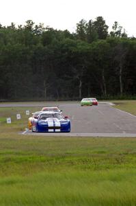 The field streams into corner 4 on the second lap