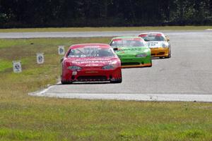 Ricky Sanders' Chevy Monte Carlo, Bill Prietzel's Chevy Monte Carlo and Tim Gray's Porsche GT3 Cup