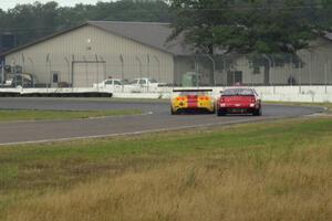 Tony Ave's Chevy Corvette and Ricky Sanders' Chevy Monte Carlo dive into turn 6