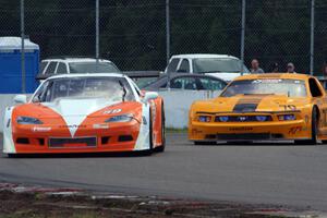 Simon Gregg's Chevy Corvette and David Jans' Ford Mustang