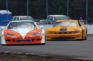 Simon Gregg's Chevy Corvette and David Jans' Ford Mustang