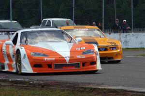 Simon Gregg's Chevy Corvette and David Jans' Ford Mustang