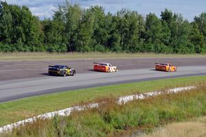 Doug Harrington's Chevy Corvette, Simon Gregg's Chevy Corvette and Bob Stretch's Chevy Camaro