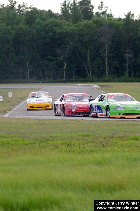 Bill Prietzel's Chevy Monte Carlo, Ricky Sanders' Chevy Monte Carlo and Tim Gray's Porsche GT3 Cup