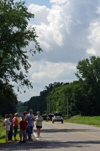 Nevy Clark's 1908 Buick putters away as spectators watch