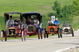 Bob Troendly's 1906 Ford, Bob Reichwaldt's 1908 Rambler, Lyle Severson's 1908 REO and Lou Spacek's 1908 Buick