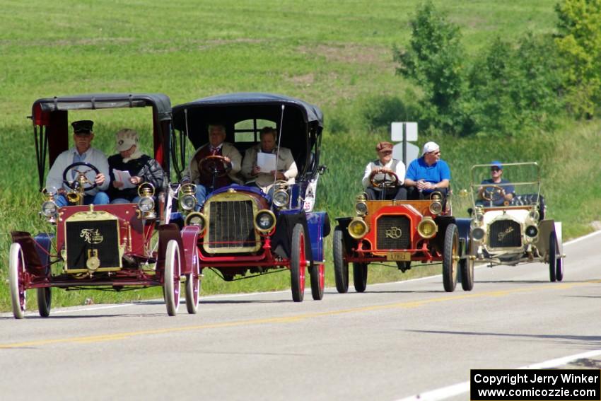 Bob Troendly's 1906 Ford, Bob Reichwaldt's 1908 Rambler, Lyle Severson's 1908 REO and Lou Spacek's 1908 Buick