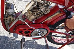 Ron Gardas tops off the oil on his 1912 Indian motorcycle