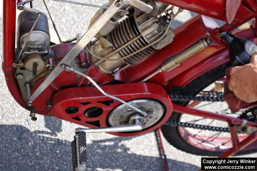 Ron Gardas tops off the oil on his 1912 Indian motorcycle