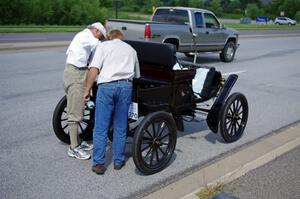 Tim Wiglesworth's 1903 Olds having more oil added