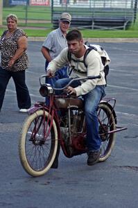 Ron Gardas, Jr. starts his 1912 Indian motorcycle