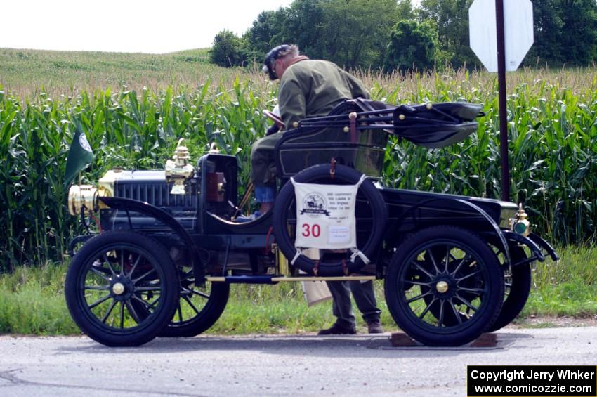 Richard Anderson's 1906 Maxwell has quick repairs done by the side of the road