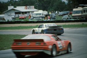 Amos Johnson's Mazda MX-6 (GTU) and Glenn Andrew's Chevy Camaro (AAC)