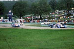 The field comes through turn 5 on the pace lap