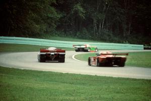 Four cars through the carousel during the race