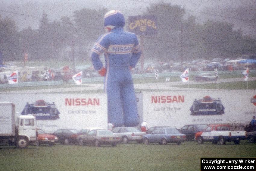 Giant inflatable Nissan driver in the fog