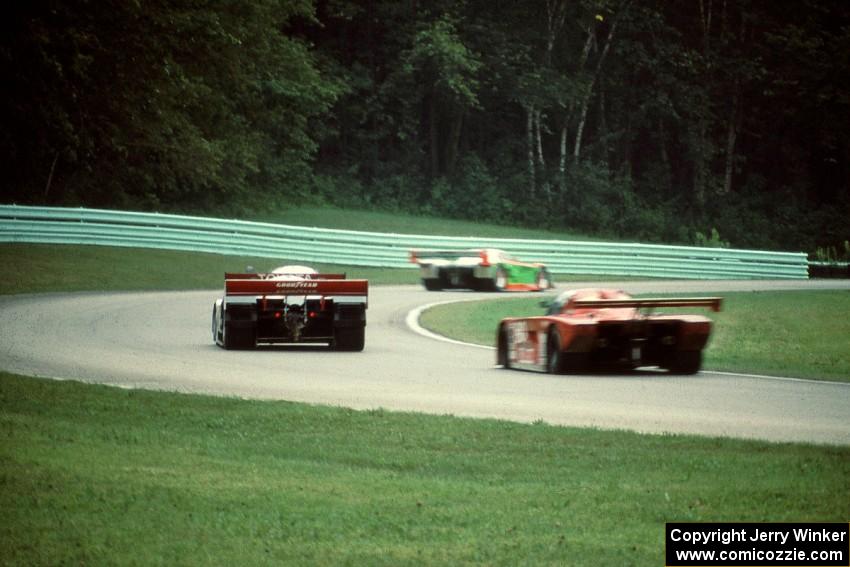 Four cars through the carousel during the race