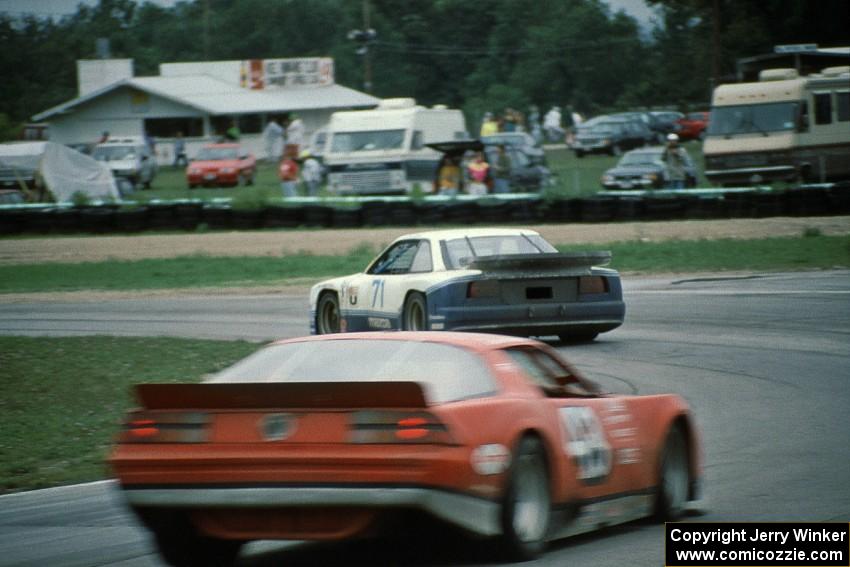 Amos Johnson's Mazda MX-6 (GTU) and Glenn Andrew's Chevy Camaro (AAC)