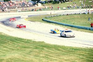 The field behind the pace car at turn 5