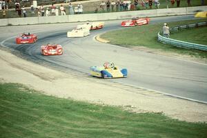 Tony Ave's Lola T-88/90 leads the field through turn 5