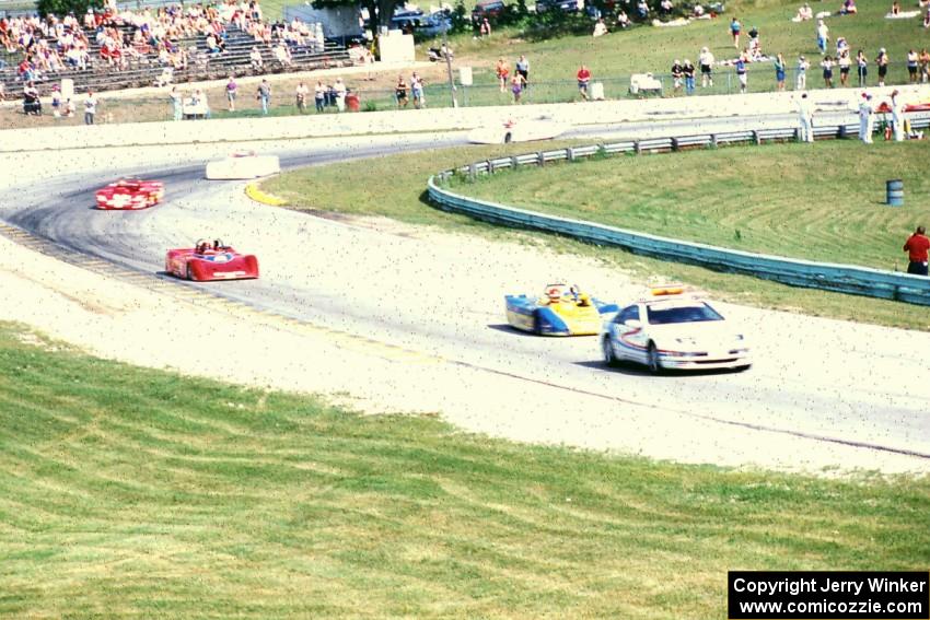 The field behind the pace car at turn 5