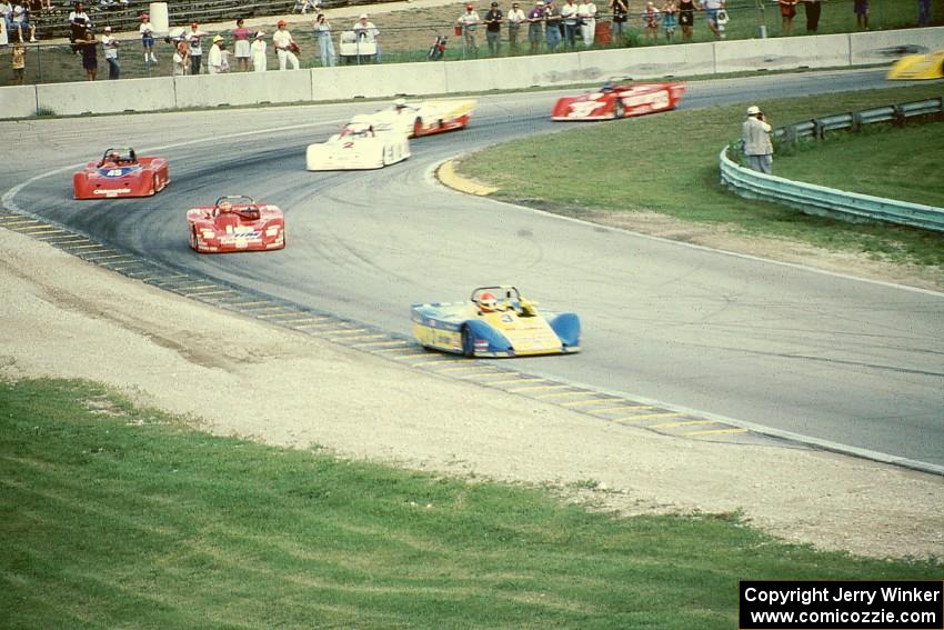 Tony Ave's Lola T-88/90 leads the field through turn 5