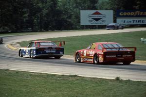 Bob Leitzinger's Nissan 240SX (GTU) leads John Fergus' Dodge Daytona (GTU)