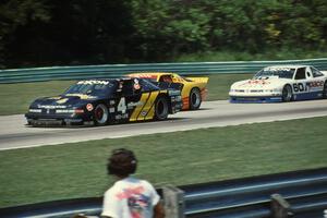 GTO battle into turn 1: Irv Hoerr's Olds Cutlass, Les Lindley's Chevy Camaro and Dick Danielson's Olds Cutlass