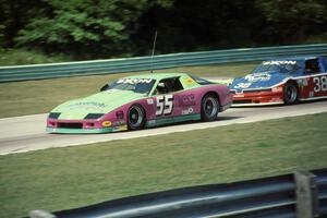 Bruce Nesbitt's Chevy Camaro (GTO)  and Joe Llauget's Olds Cutlass (GTO)