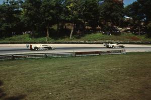 The Eagle Mk. III/Toyotas of P.J. Jones and Juan-Manuel Fangio II exit Canada Corner