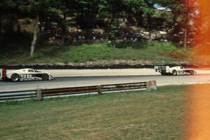 The Eagle Mk. III/Toyotas of P.J. Jones and Juan-Manuel Fangio II exit Canada Corner