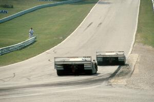 The Eagle Mk. III/Toyotas of P.J. Jones and Juan-Manuel Fangio II head uphill to corner 6