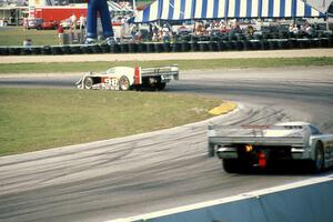 The Eagle Mk. III/Toyotas of P.J. Jones and Juan-Manuel Fangio II through corner 5