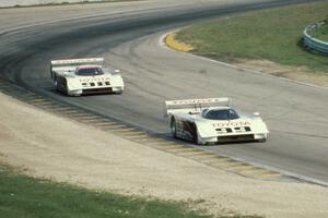 The Eagle Mk. III Toyotas of Juan-Manuel Fangio II and P.J. Jones head uphill to turn 6