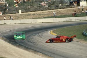 John Grooms / Frank Jellinek Kudzu DG-1/Mazda  (Lights) passes the sideways Tom Hessert / Bob Schader Spice SE87L/Buick (Lights)