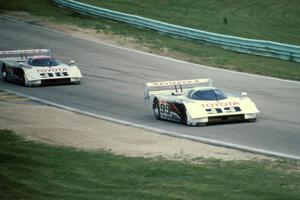 The Eagle Mk. III Toyotas of Juan-Manuel Fangio II and P.J. Jones head uphill to turn 6