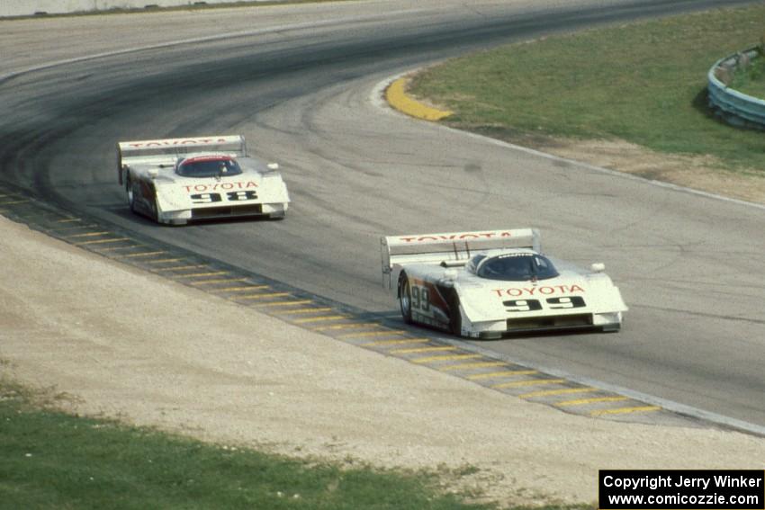 The Eagle Mk. III Toyotas of Juan-Manuel Fangio II and P.J. Jones head uphill to turn 6