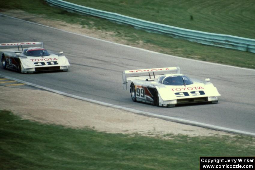 The Eagle Mk. III Toyotas of Juan-Manuel Fangio II and P.J. Jones head uphill to turn 6