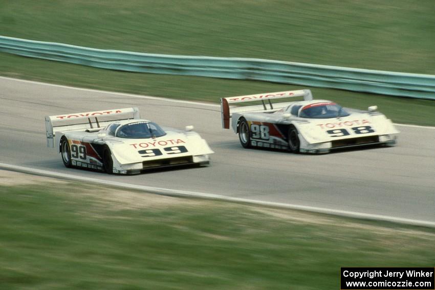 The Eagle Mk. III/Toyotas of Juan-Manuel Fangio II and P.J. Jones head uphill to turn 6 on the cool off lap