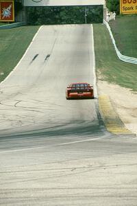 John Fergus' Dodge Daytona (GTU) heads uphill towards the Corvette bridge