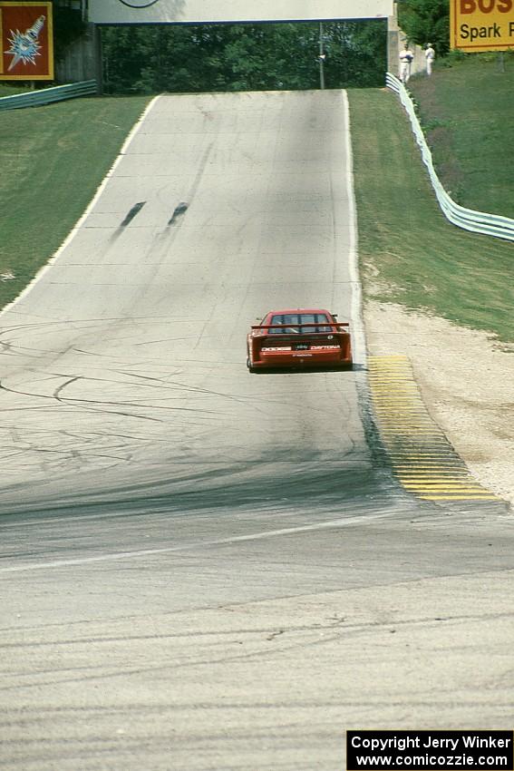 John Fergus' Dodge Daytona (GTU) heads uphill towards the Corvette bridge