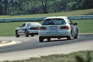 Scott Kronn / Bob Roth Honda Civic Si follows the Richard Guider / David Lapham Mazda RX-7 Turbo