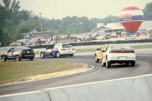 Four cars come through corner five